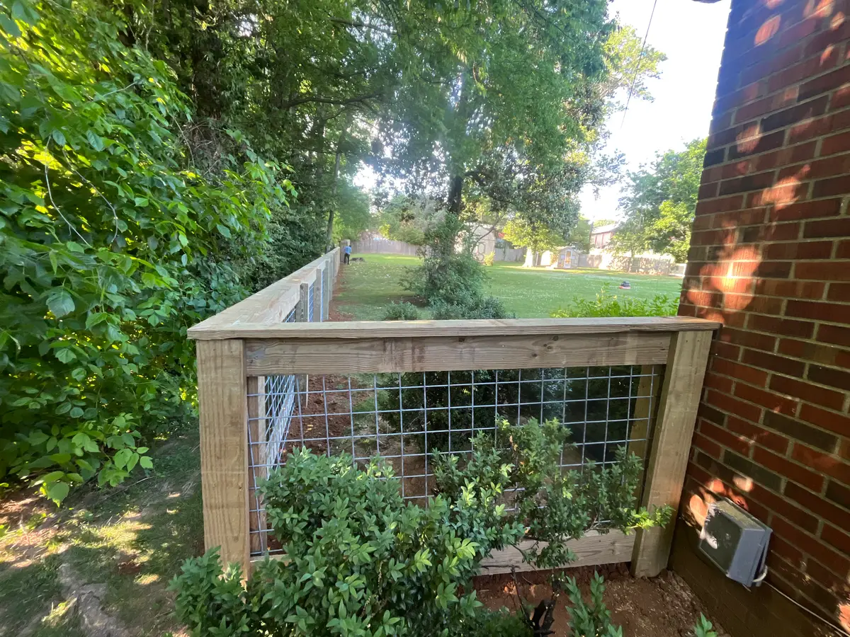 Wood wire animal pen fence, installed by Duck Duck Fence