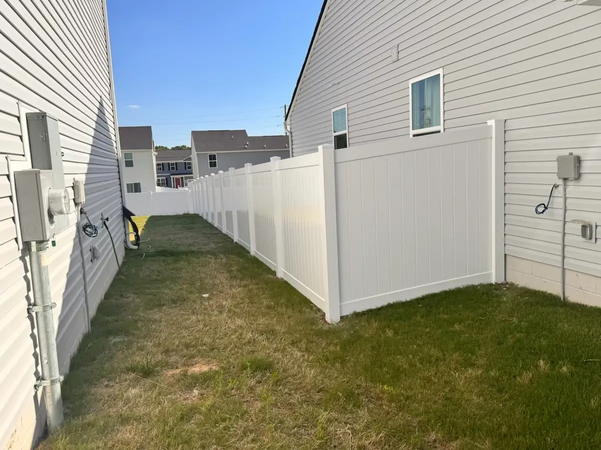 White vinyl privacy fence, installed by Duck Duck Fence