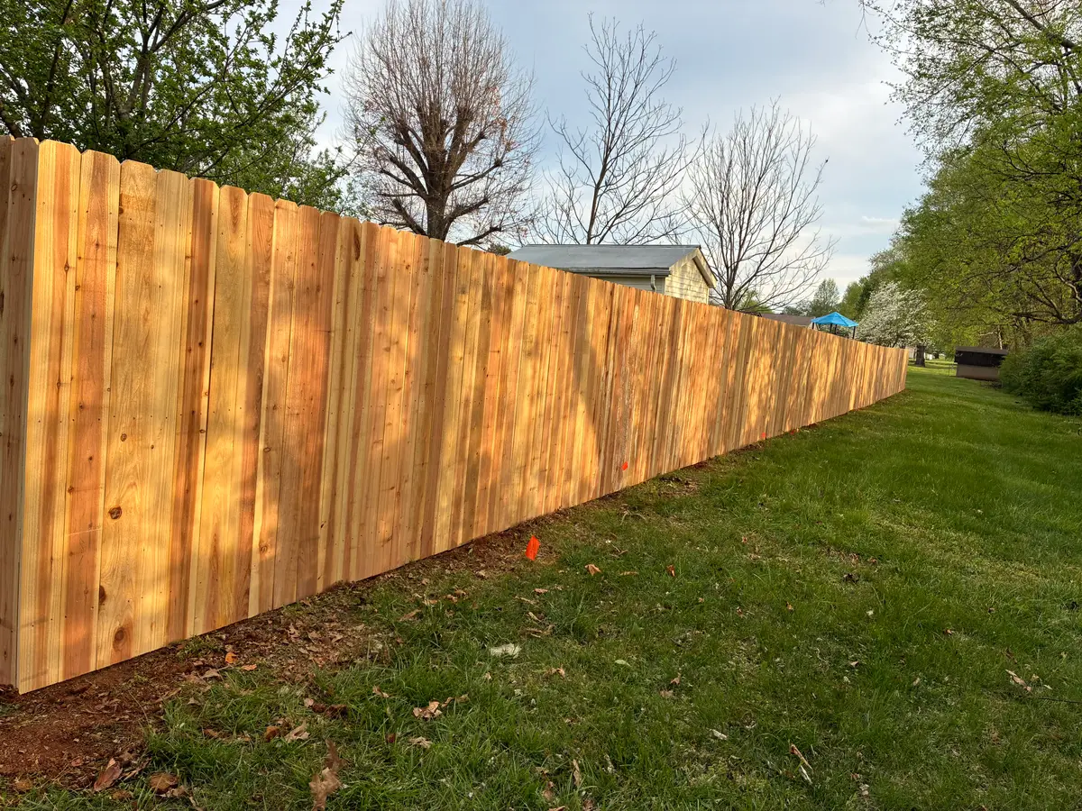 Long diagonal wood privacy fence, installed by Duck Duck Fence