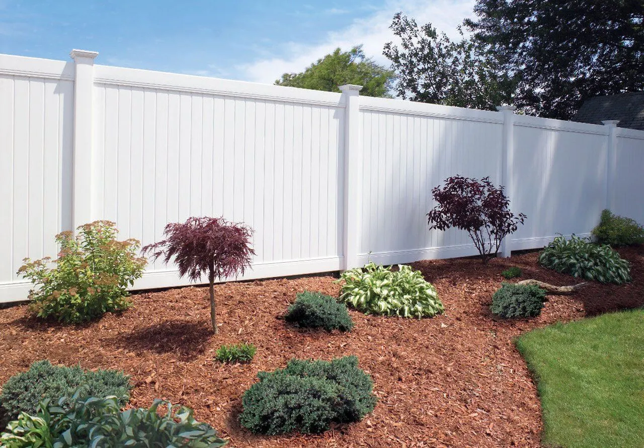 White vinyl privacy fence installed by Duck Duck Fence